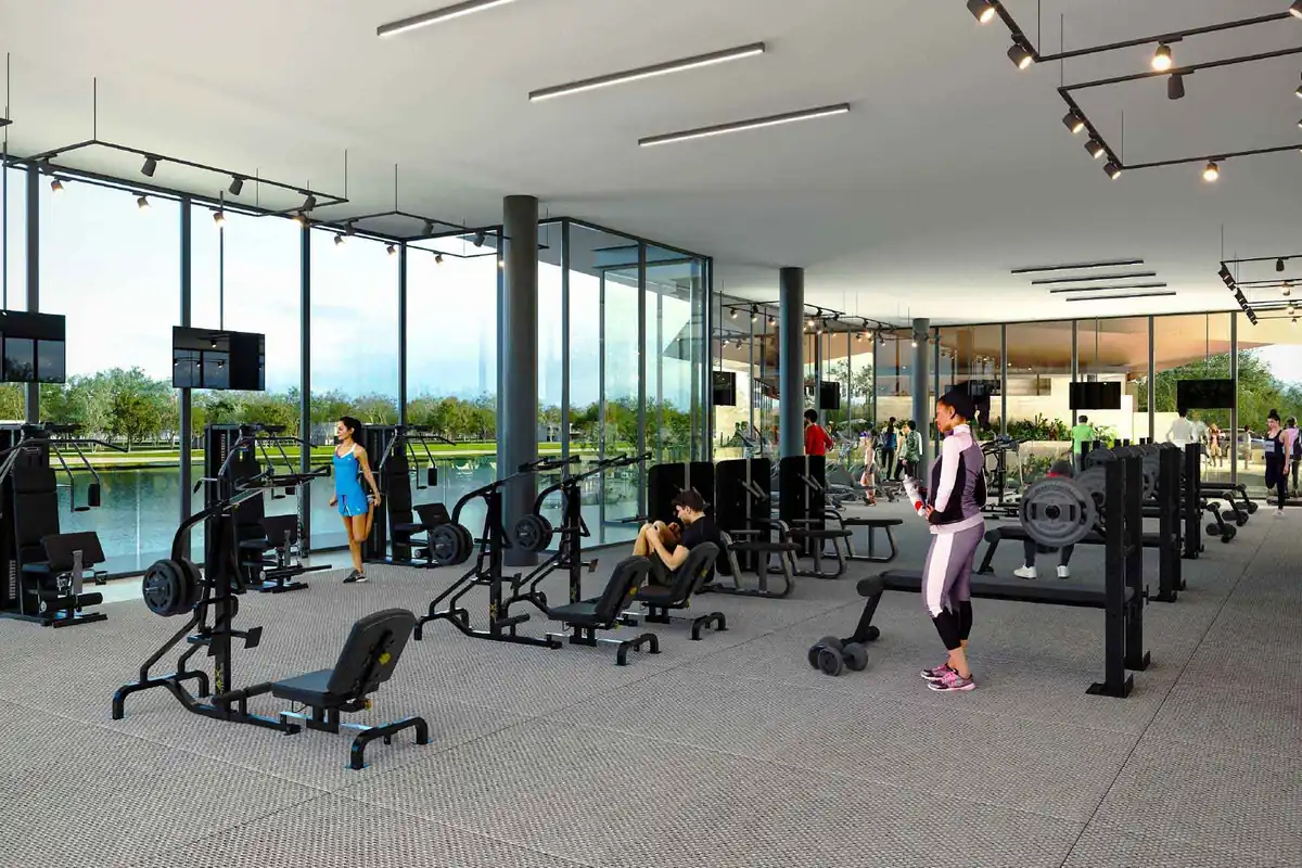 Render del gimnasio de Gran Provincia de SIMCA Desarrollos con equipo de entrenamiento y ventanales.