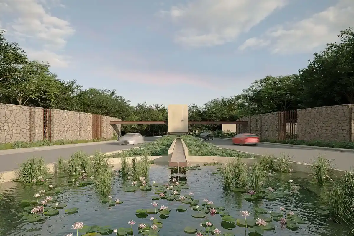Render del acceso principal de Nórtico Residencial, de SIMCA Desarrollos, con caseta, vegetación y espejo de agua.